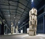 Photo of Anselm Kiefer's Seven Heavenly Palaces at Hangar Bicocca, by: Gampe - Own work, CC BY-SA 4.0, https://commons.wikimedia.org/w/index.php?curid=70618256